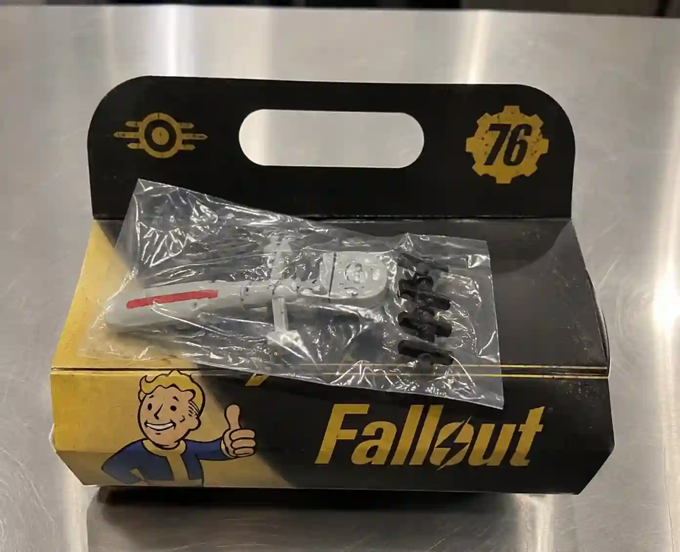 Fallout-themed meal box with collectible toy in a clear plastic bag