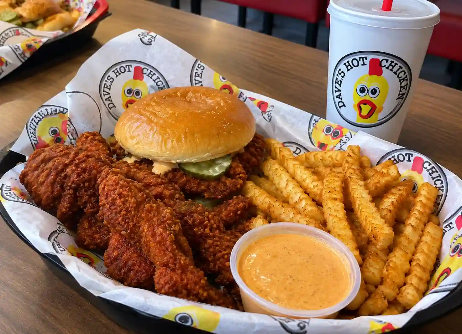 Dave’s Hot Chicken Salem menu with crispy chicken, fries, sandwich, and dipping sauce